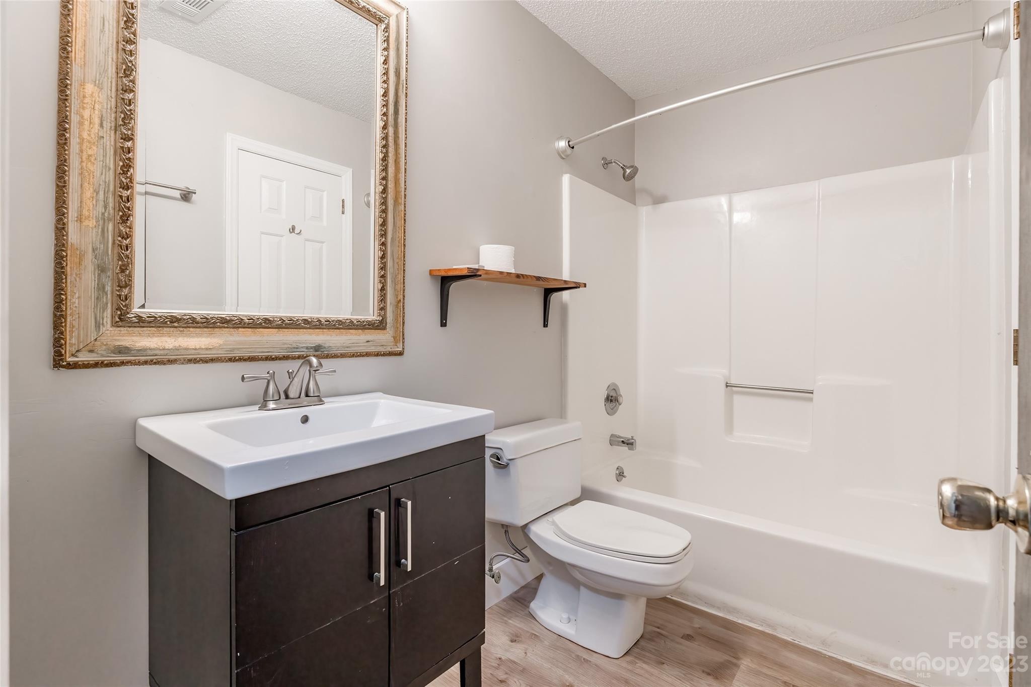 2117 Bon Villa Way Tega Cay, SC 29708 - Photo 13 of 25 a bathroom with a sink a toilet and shower