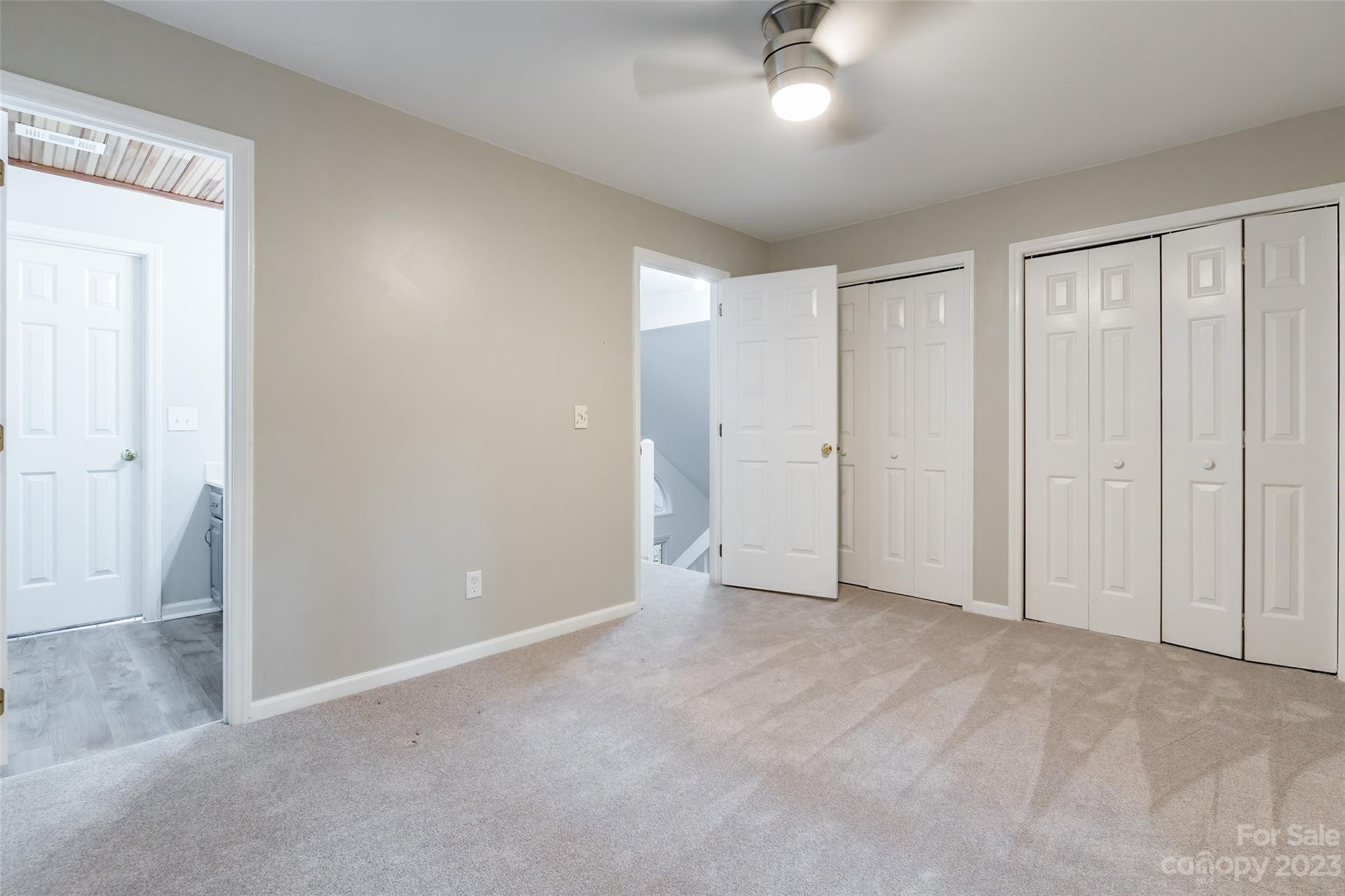 2117 Bon Villa Way Tega Cay, SC 29708 - Photo 17 of 25 an empty room with fan closet and chandelier fan
