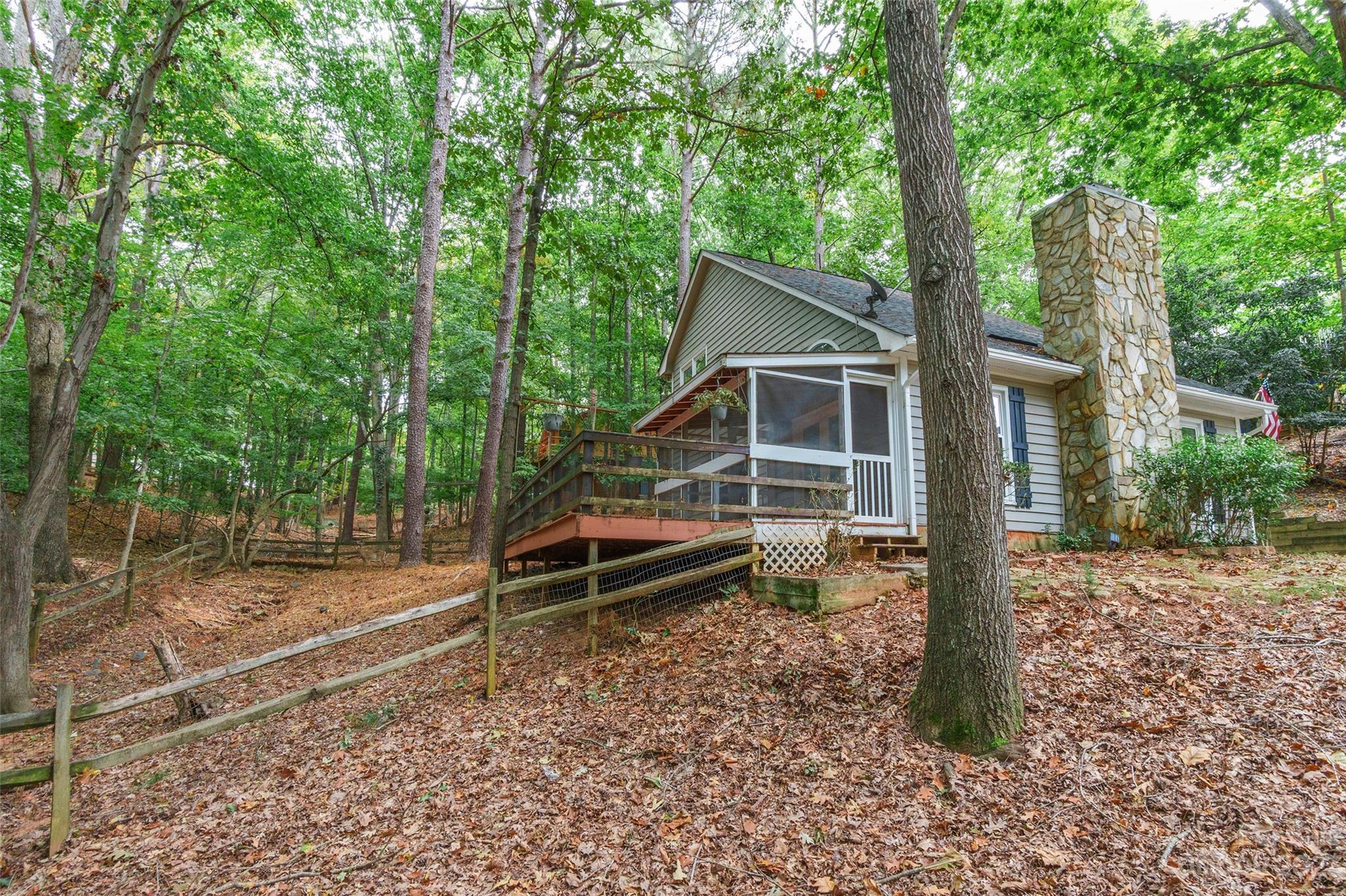2117 Bon Villa Way Tega Cay, SC 29708 - Photo 24 of 25 a wooden bench sitting in front of a house