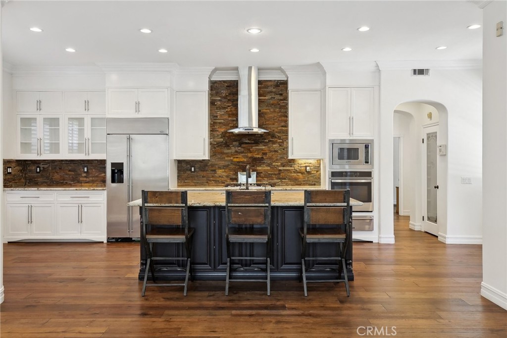 18 Winfield Drive Ladera Ranch, CA 92694 - Photo 1 of 39 a kitchen with stainless steel appliances granite countertop a kitchen island a stove a table and chairs