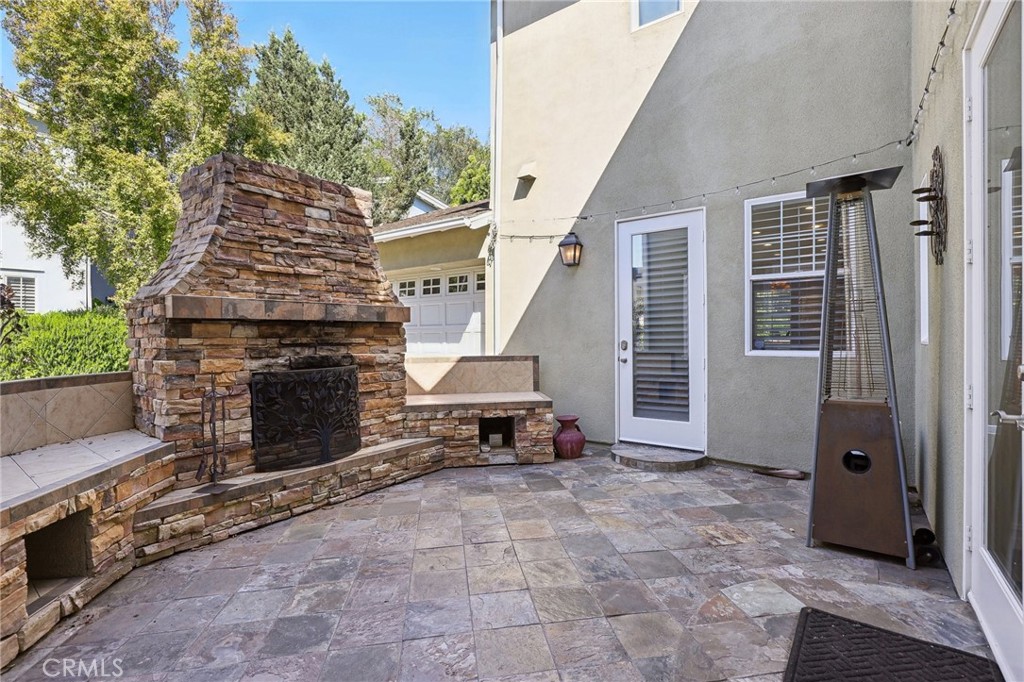 18 Winfield Drive Ladera Ranch, CA 92694 - Photo 13 of 39 a view of a porch with furniture and a fireplace