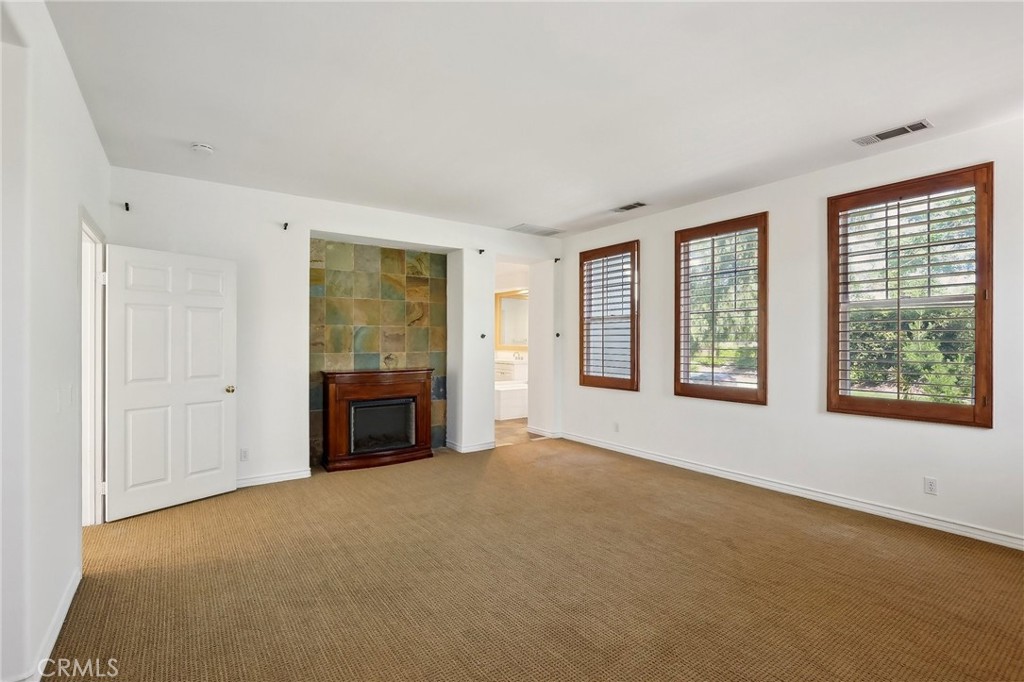 18 Winfield Drive Ladera Ranch, CA 92694 - Photo 20 of 39 a big room with windows and a fireplace