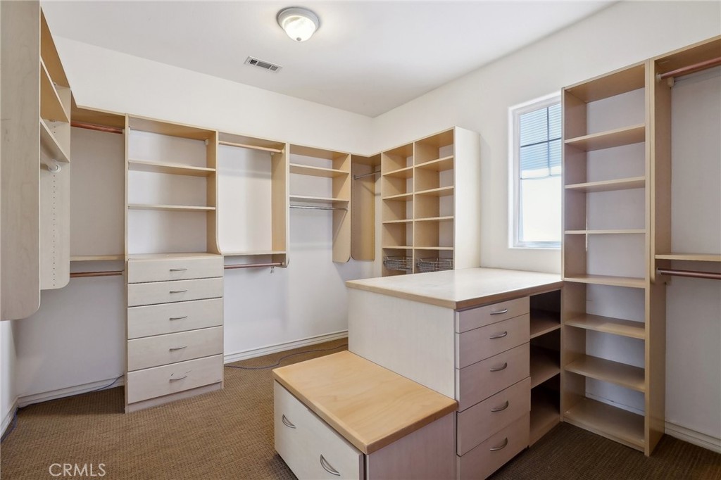 18 Winfield Drive Ladera Ranch, CA 92694 - Photo 24 of 39 a room with cabinets and a window