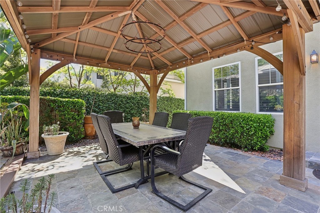18 Winfield Drive Ladera Ranch, CA 92694 - Photo 39 of 39 a view of a patio with table and chairs under an umbrella