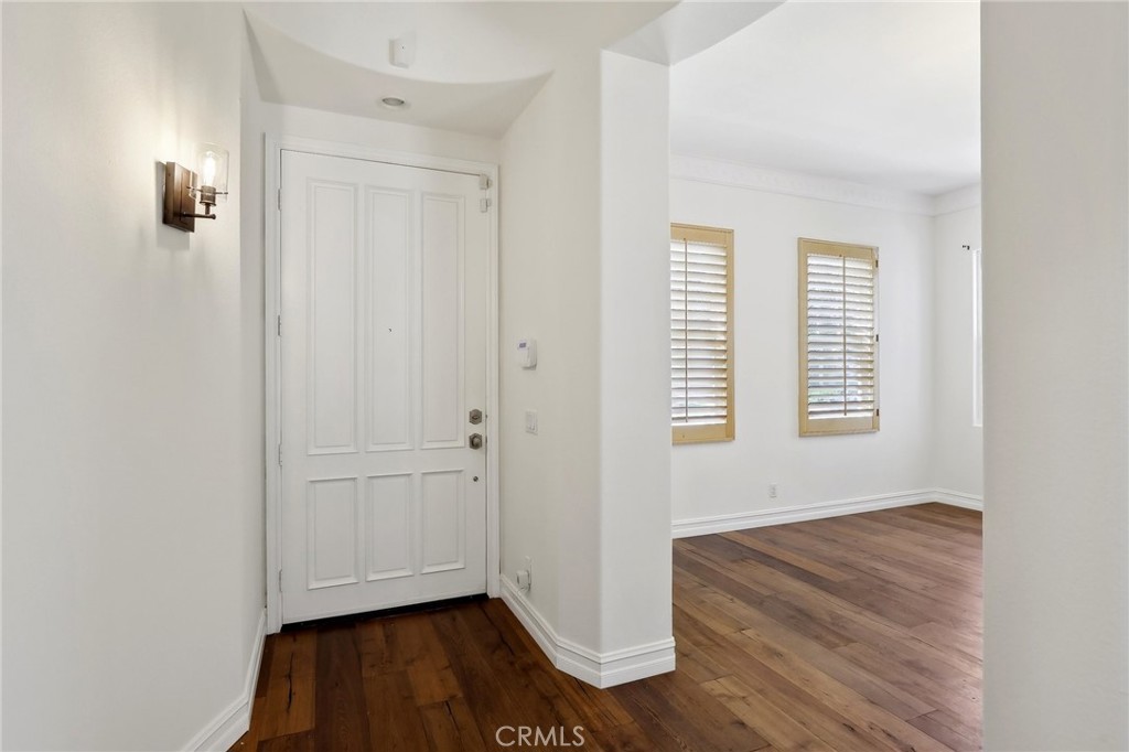18 Winfield Drive Ladera Ranch, CA 92694 - Photo 7 of 39 an empty room with wooden floor and windows