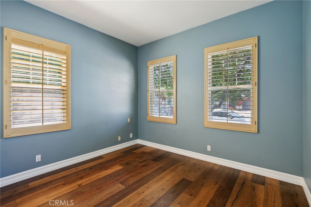 18 Winfield Drive Ladera Ranch, CA 92694 - Photo 10 of 39 a view of an empty room with wooden floor and a window
