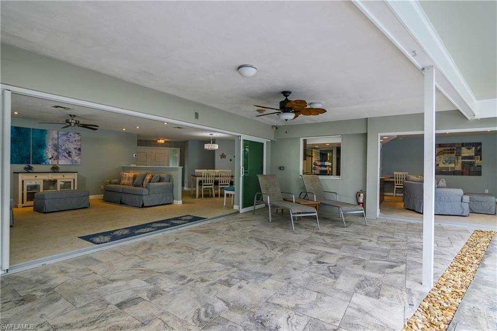 330 Country Club Drive Naples, FL 34110 - Photo 28 of 37 a view of a livingroom with furniture and a ceiling fan