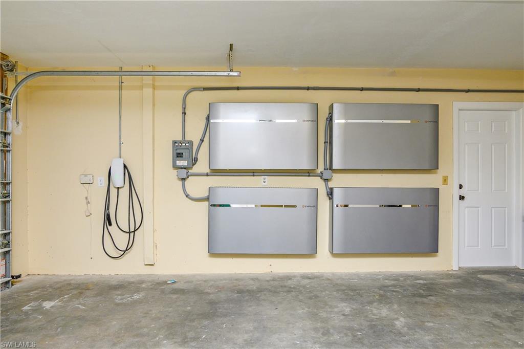 330 Country Club Drive Naples, FL 34110 - Photo 34 of 37 a view of a garage with wooden walls