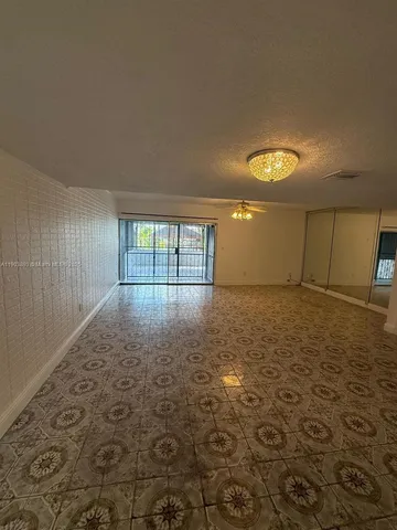 a view of a bathroom with a sink and a mirror