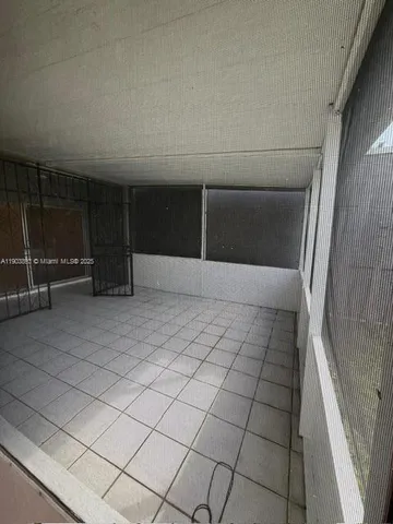 a view of empty room with windows