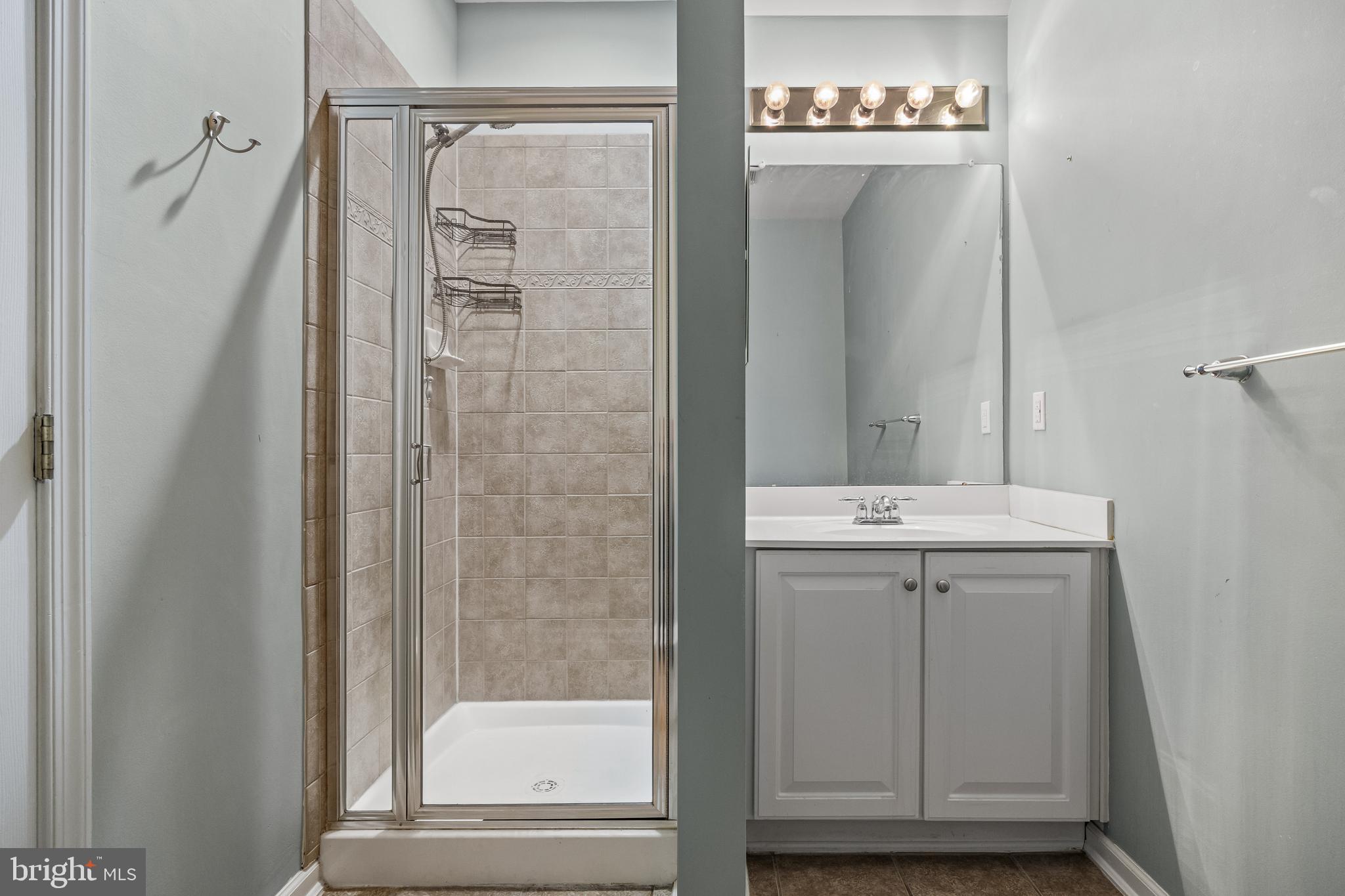 5 River Lane Delanco, NJ 08075 - Photo 12 of 26 a bathroom with a shower and a sink