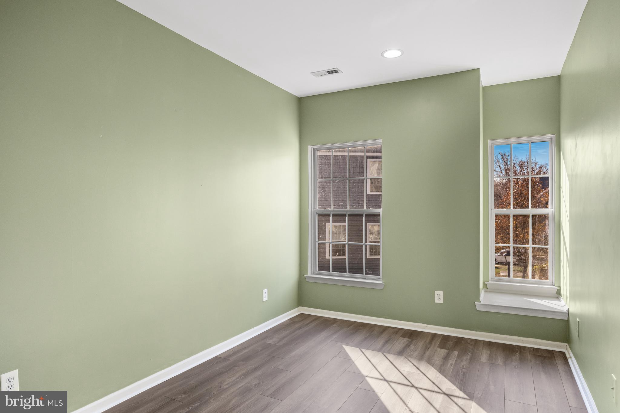 5 River Lane Delanco, NJ 08075 - Photo 16 of 26 an empty room with wooden floor and windows