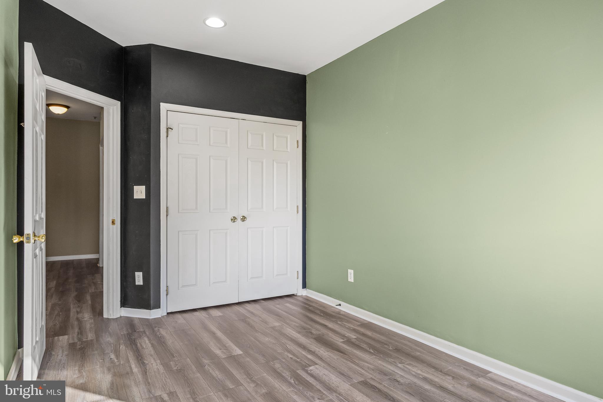 5 River Lane Delanco, NJ 08075 - Photo 17 of 26 an empty room with wooden floor and closet