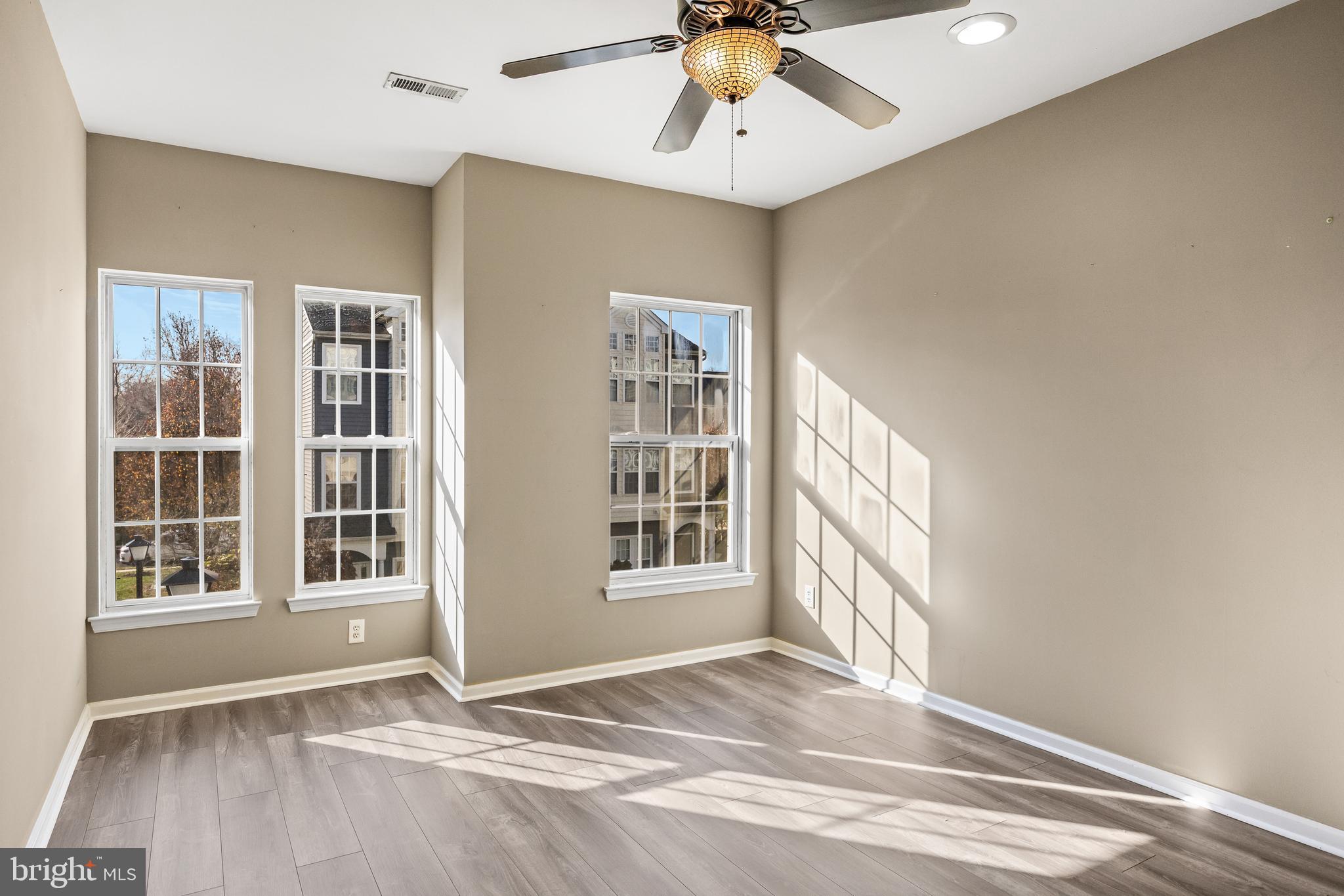 5 River Lane Delanco, NJ 08075 - Photo 18 of 26 a view of an empty room with a window and wooden floor