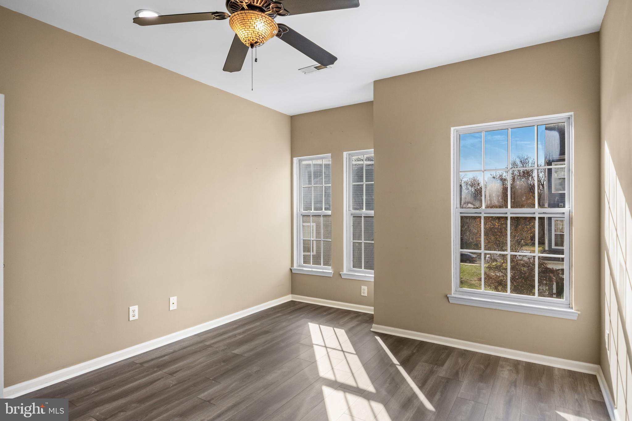 5 River Lane Delanco, NJ 08075 - Photo 19 of 26 a view of an empty room with a window and wooden floor