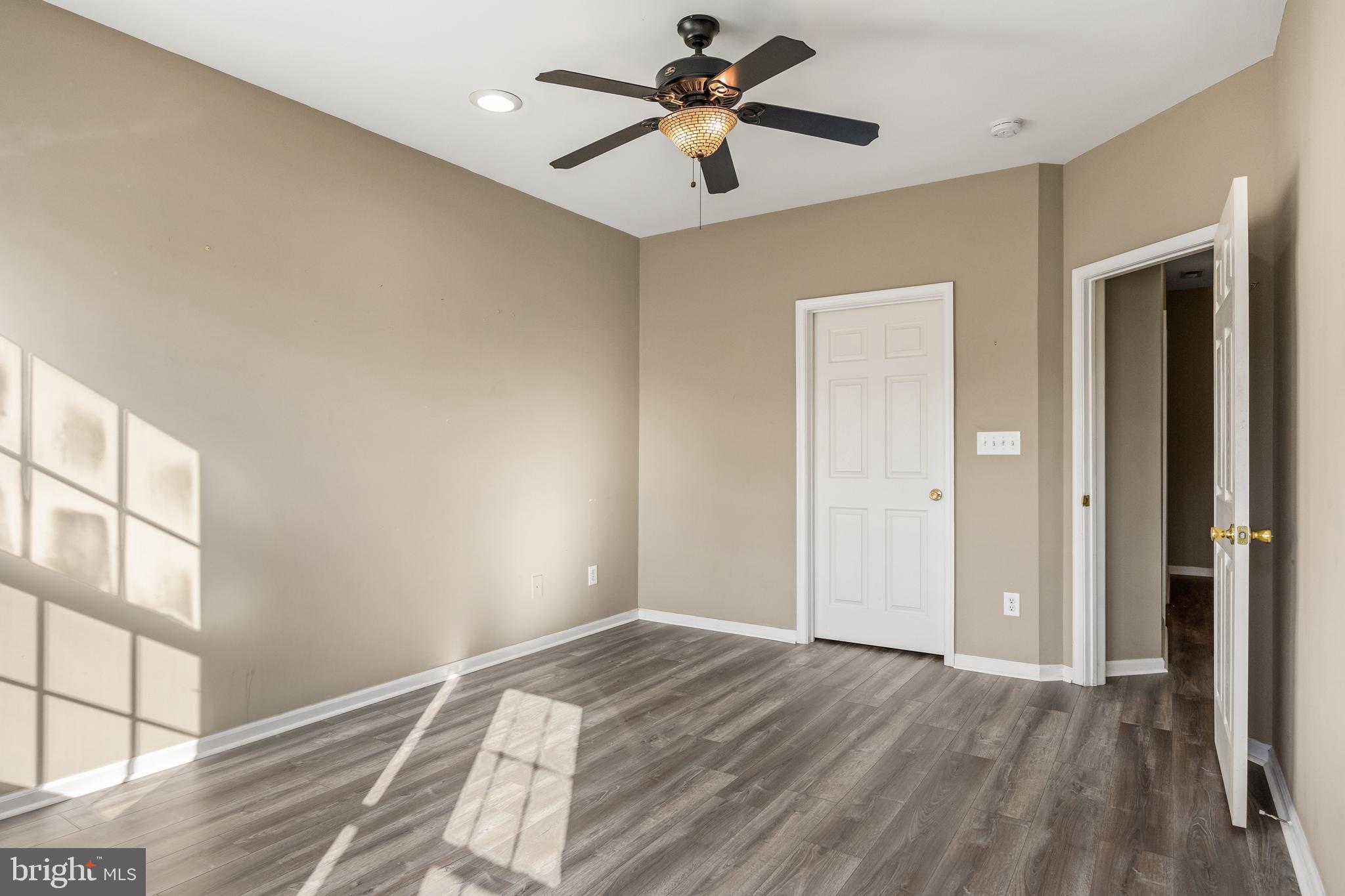 5 River Lane Delanco, NJ 08075 - Photo 20 of 26 a view of empty room with wooden floor and fan