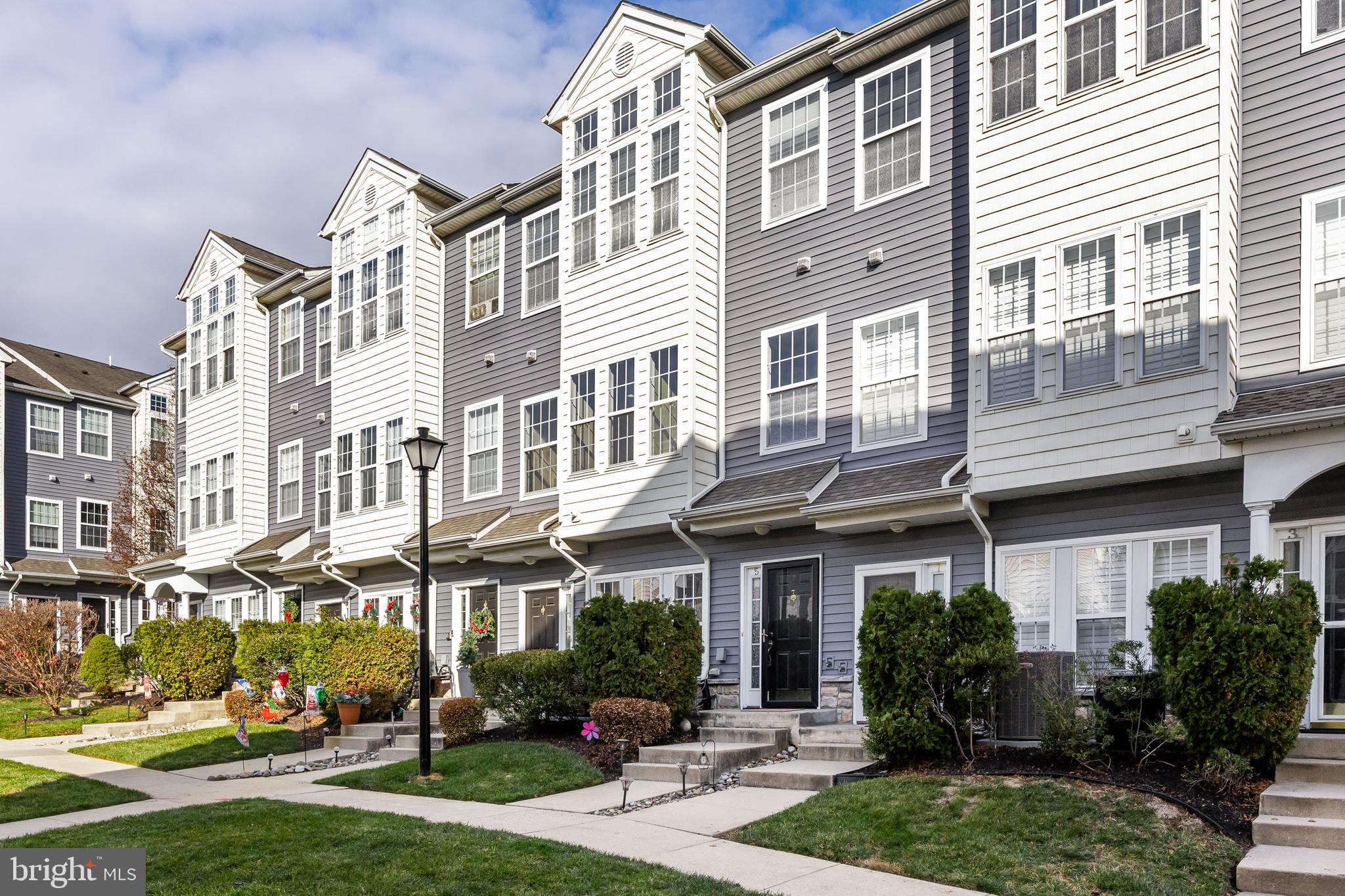 5 River Lane Delanco, NJ 08075 - Photo 2 of 26 a view of a brick building next to a yard