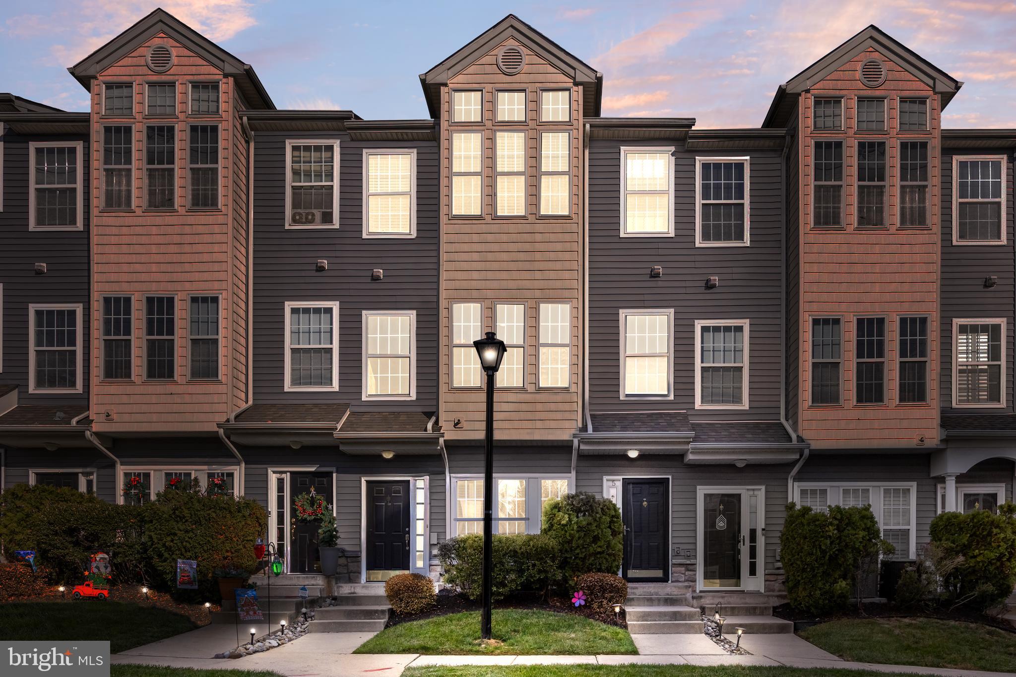 5 River Lane Delanco, NJ 08075 - Photo 26 of 26 a front view of a brick building with many windows and a yard