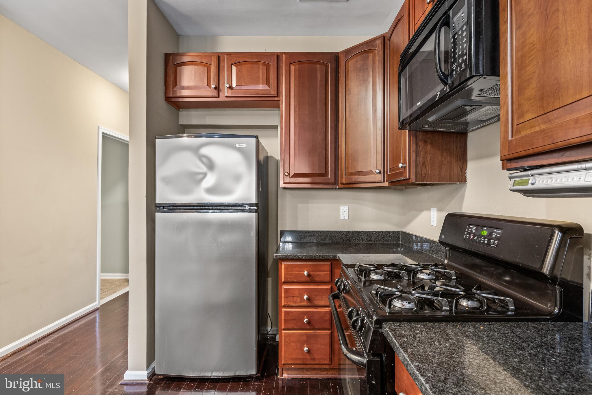5 River Lane Delanco, NJ 08075 - Photo 6 of 26 a kitchen with stainless steel appliances granite countertop a refrigerator and a stove