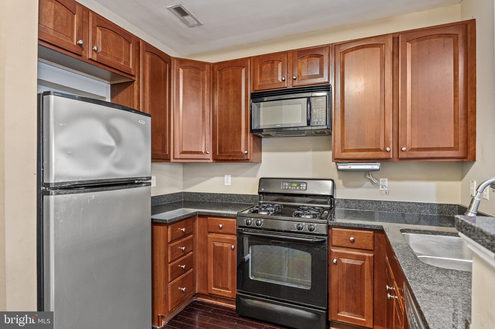 5 River Lane Delanco, NJ 08075 - Photo 7 of 26 a kitchen with stainless steel appliances granite countertop a refrigerator stove and microwave