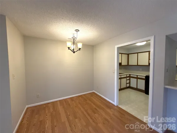a view of empty room with a fireplace