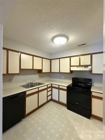 a kitchen with lots of counter top space and appliances