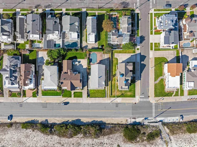 an aerial view of a house with a swimming pool