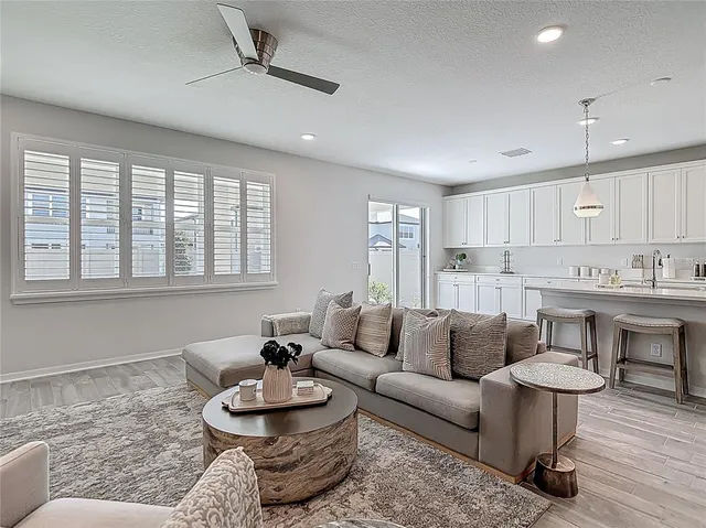 a bedroom with a bed and a night stand