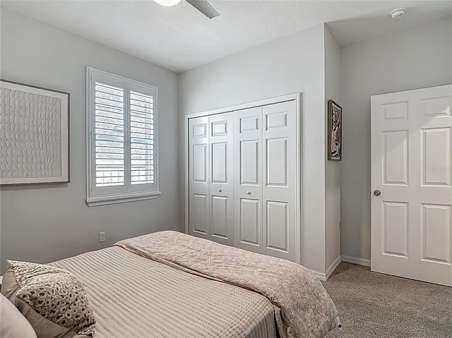 a bedroom with furniture and a window