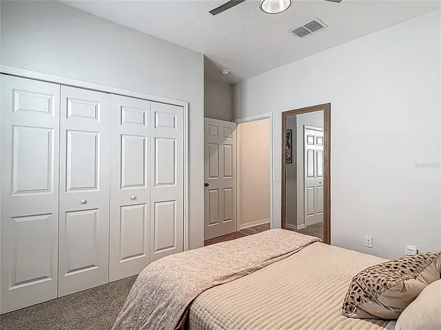 a bedroom with a bed and a cabinets