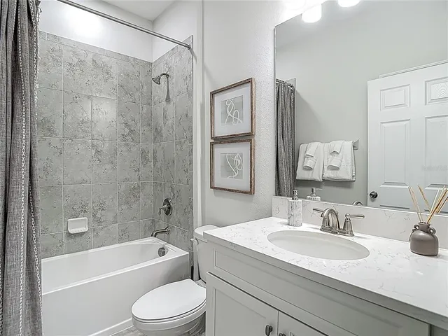 a view of an house with backyard space and balcony