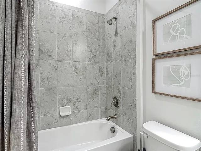 a front view of house with yard and garage