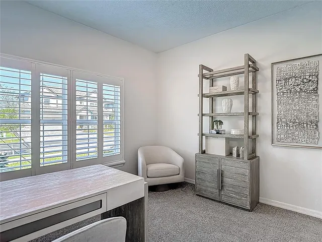 an aerial view of a house with a lake view
