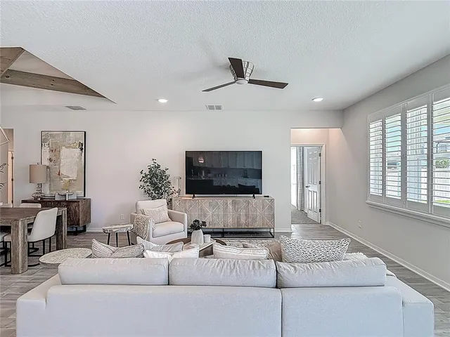 a view of a dining room with furniture window and wooden floor