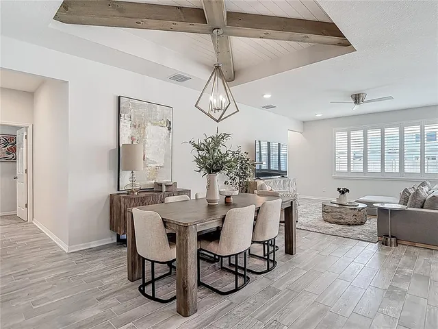 an aerial view of multiple houses with a city