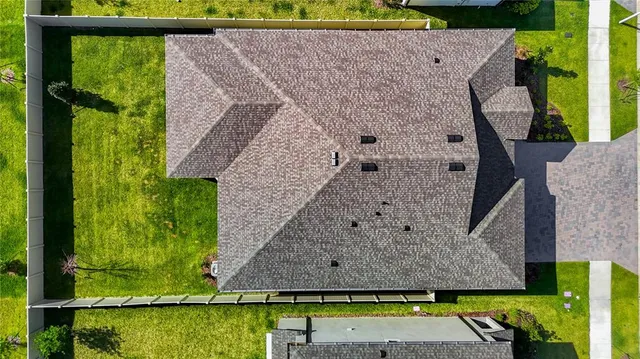 a kitchen with stainless steel appliances granite countertop white cabinets a sink and dishwasher