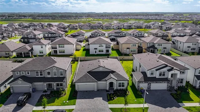 a kitchen with cabinets and stainless steel appliances