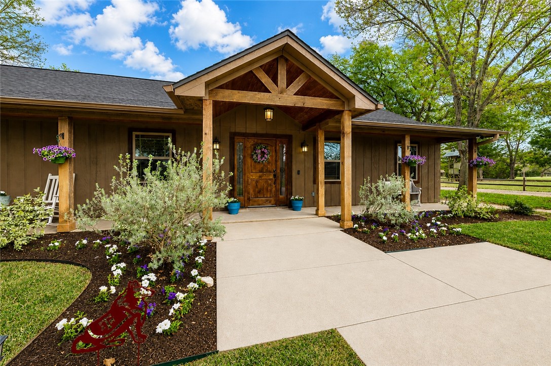 2302 Quail Run College Station, TX 77845 - Photo 1 of 49 front view of a house with a yard