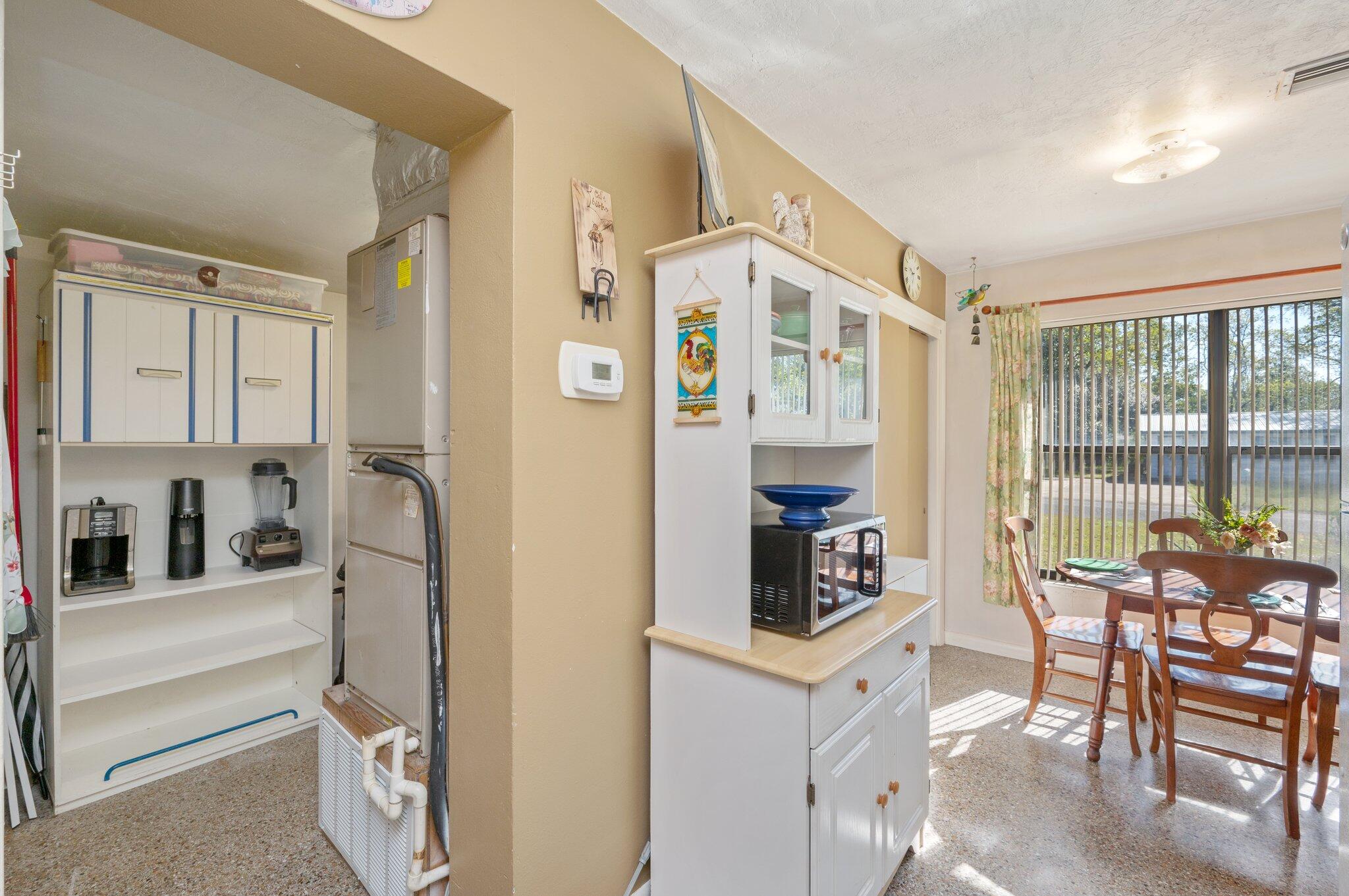 611 Shrewsbury Road Mary Esther, FL 32569 - Photo 11 of 36 a kitchen with stainless steel appliances granite countertop a refrigerator and a dining table
