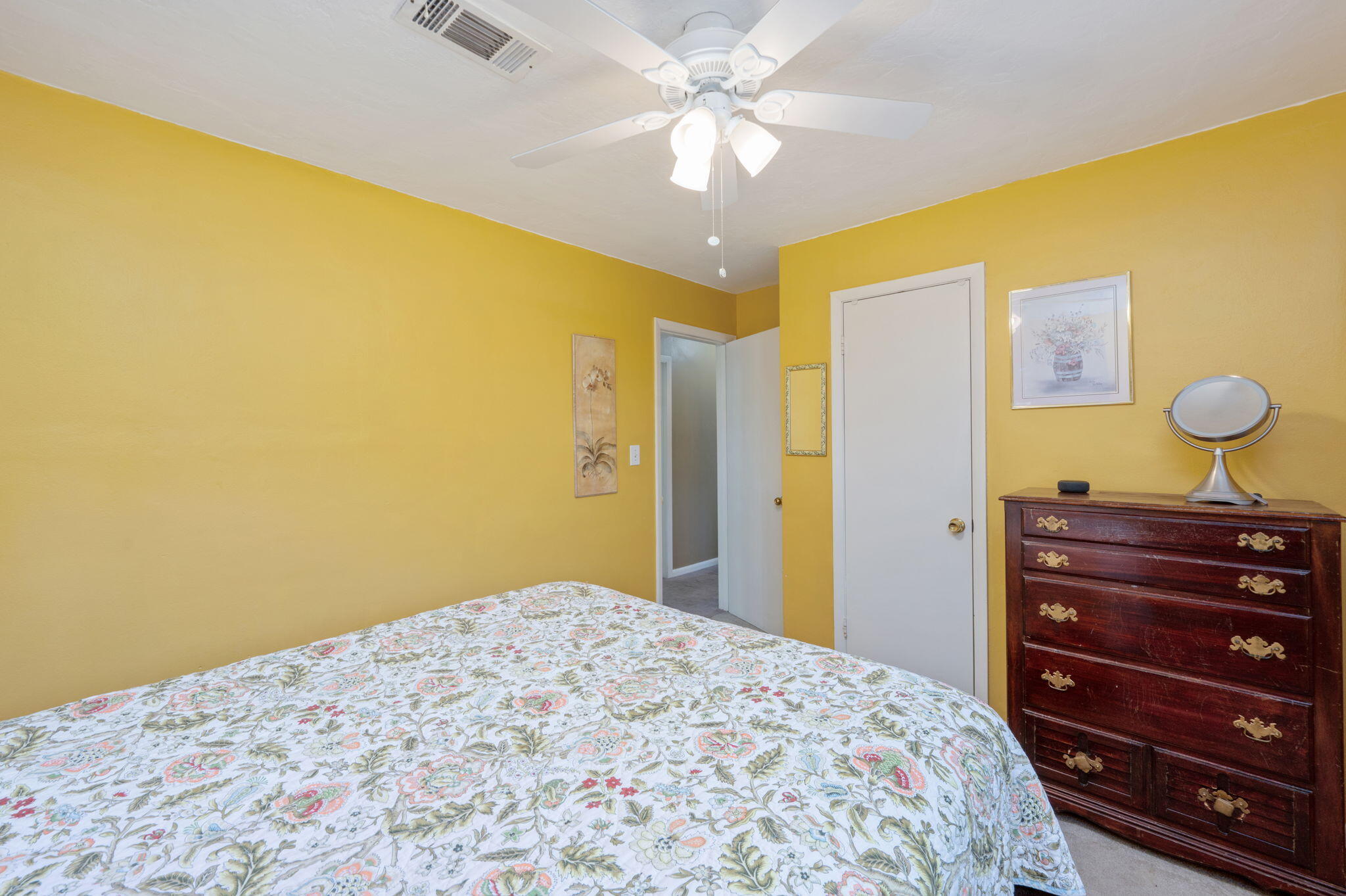 611 Shrewsbury Road Mary Esther, FL 32569 - Photo 16 of 36 a bedroom with a bed and a chandelier