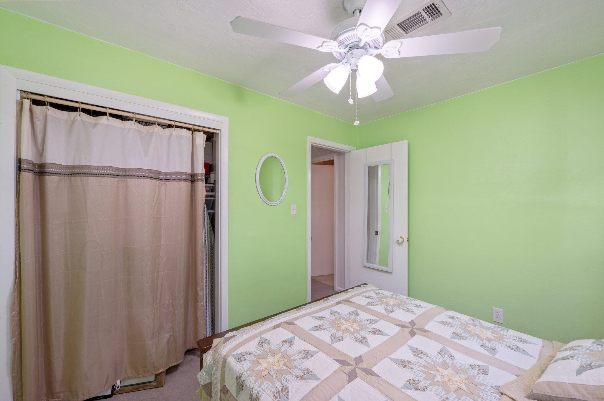 611 Shrewsbury Road Mary Esther, FL 32569 - Photo 21 of 36 a bedroom with a bed and a chandelier