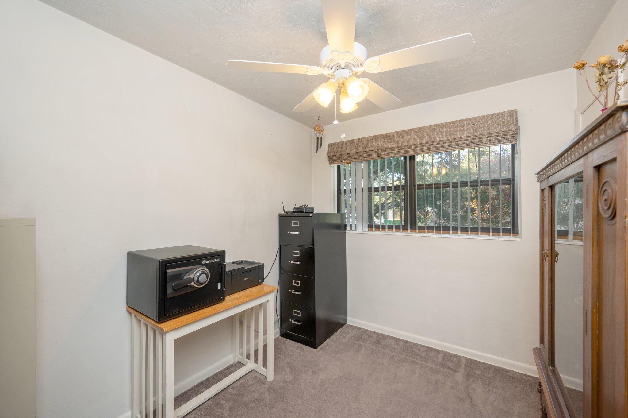 611 Shrewsbury Road Mary Esther, FL 32569 - Photo 22 of 36 an empty room with windows and fan