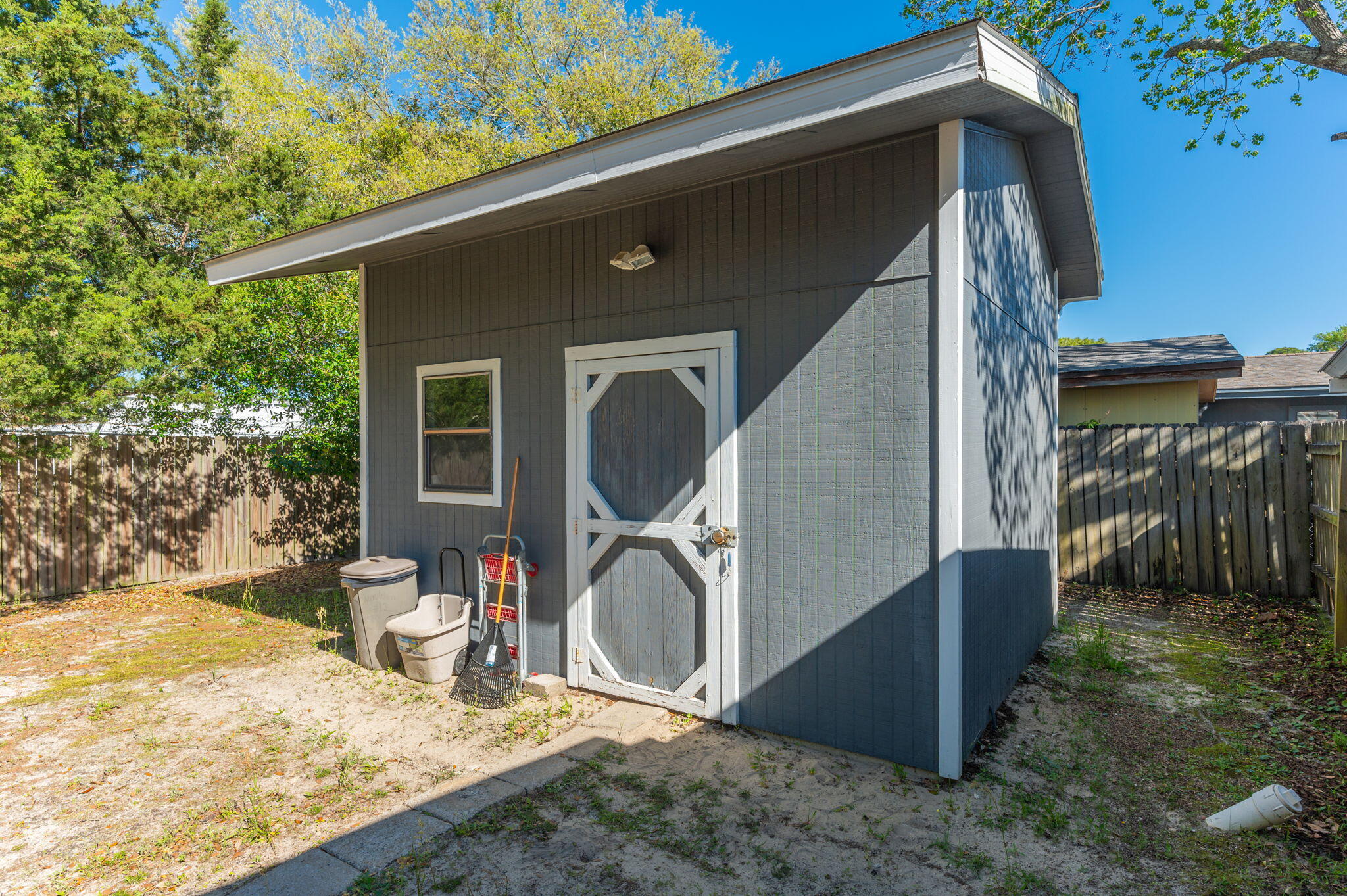611 Shrewsbury Road Mary Esther, FL 32569 - Photo 26 of 36 a backyard of a house with seating space