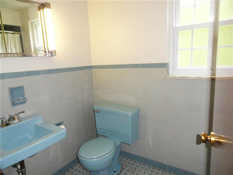 4221 Pine Hollow Road Trafford, PA 15085 - Photo 22 of 25 Well maintained 2nd floor full bath with original tile basket weave floor