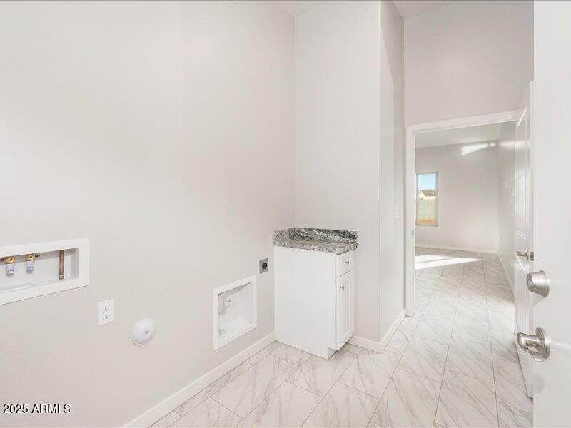 3805 North Estrella Road Eloy, AZ 85131 - Photo 18 of 32 a view of a storage & utility room with a sink