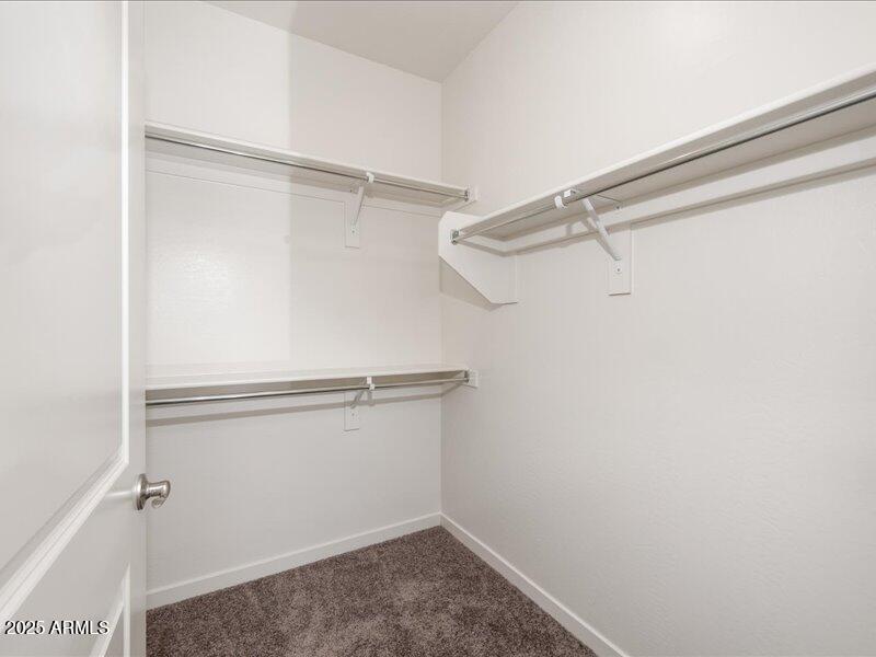 3805 North Estrella Road Eloy, AZ 85131 - Photo 19 of 32 a view of a room with racks on the wall