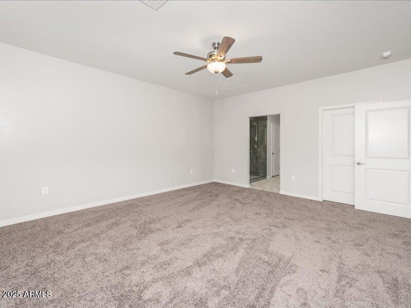 3805 North Estrella Road Eloy, AZ 85131 - Photo 21 of 32 a view of a livingroom with a ceiling fan and window