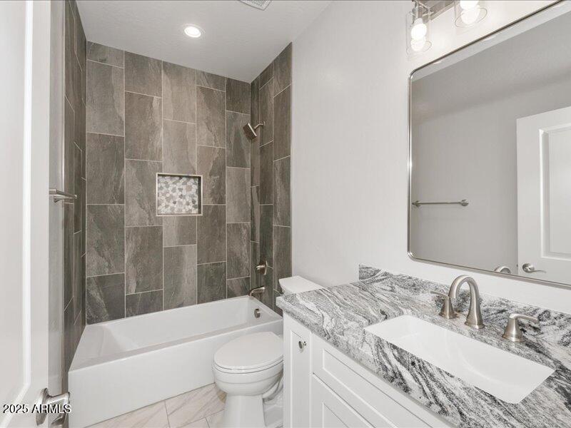 3805 North Estrella Road Eloy, AZ 85131 - Photo 5 of 32 a bathroom with a granite countertop sink toilet mirror and bathtub