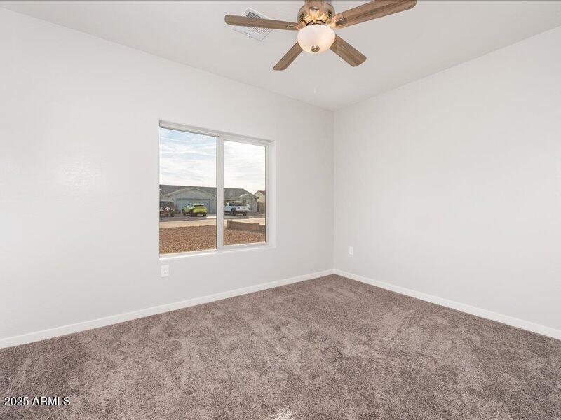 3805 North Estrella Road Eloy, AZ 85131 - Photo 6 of 32 an empty room with a window