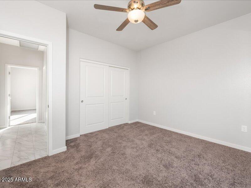 3805 North Estrella Road Eloy, AZ 85131 - Photo 7 of 32 an empty room with fan
